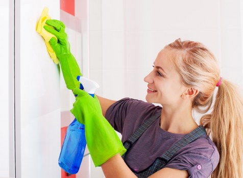 Cleaning professional beginning a service visit with tools prepared