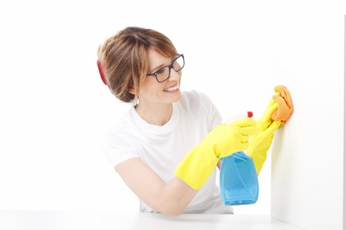 Cleaning staff working in a modern Battersea office kitchen and breakout space
